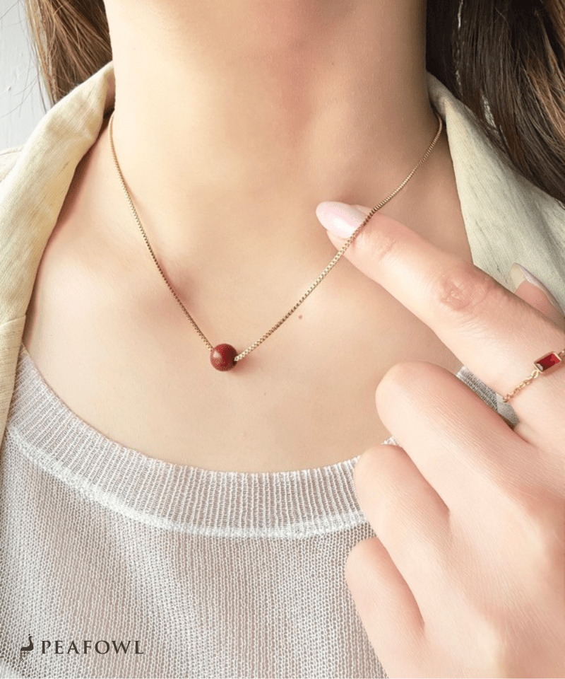 Red Ball Necklace - peafowl